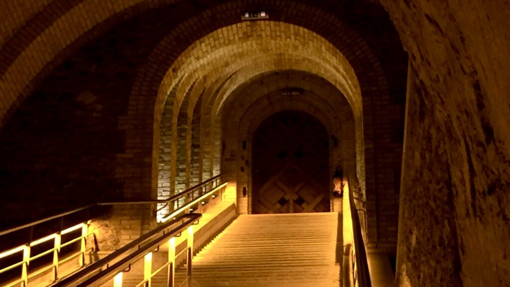 Champagne house cellar staircase leading to an underground tasting area in Reims