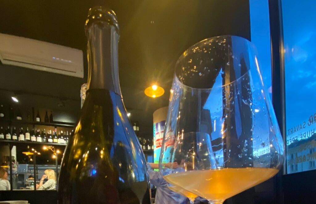 A glass of Champagne at a wine bar in the evening